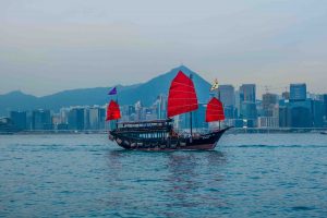 Photo of a boat with red sails in Hong Kong